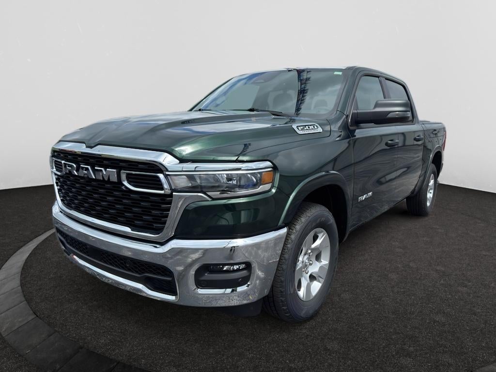 2026 RAM Ram 1500 RAM 1500 BIG HORN CREW CAB 4X4 5'7' BOX in Serrano-Green Metallic Exterior Paint — front three-quarter view