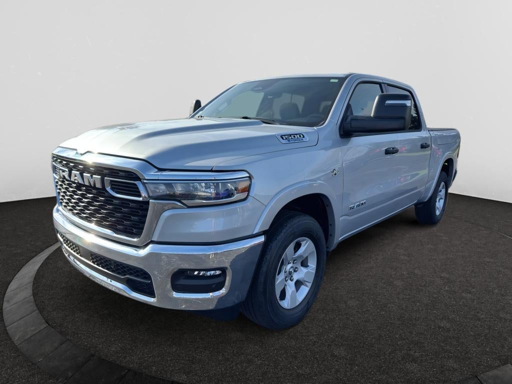 2026 RAM Ram 1500 RAM 1500 BIG HORN CREW CAB 4X4 5'7' BOX in Silver Zynith Exterior Paint — front three-quarter view
